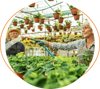 Business owner watering plants